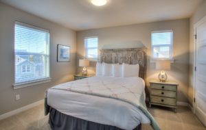 The bedroom of an Ocean Shores vacation rental to relax in while searching for dog-friendly things to do "near me."