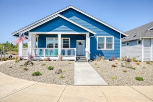 A vacation rental in Ocean Shores with a front porch to enjoy the nice weather on.