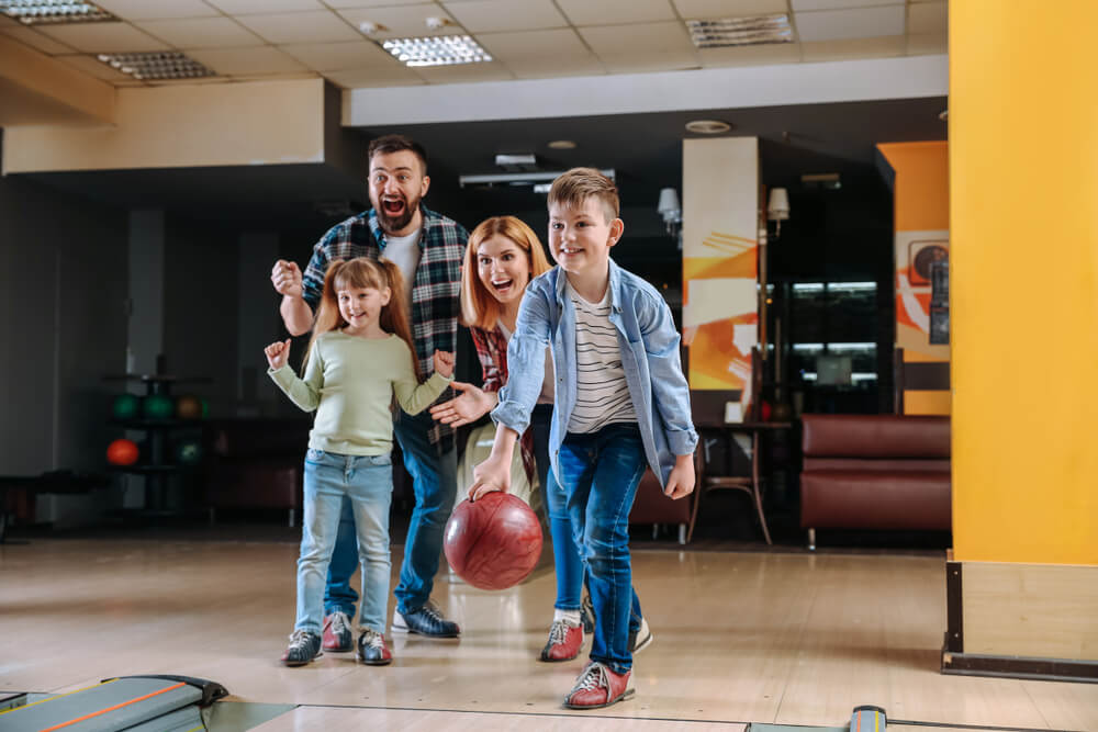 A family bowling in Ocean Shores.