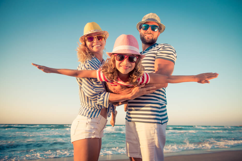 A family on the beach in Ocean Shores during a summer vacation in Washington State.