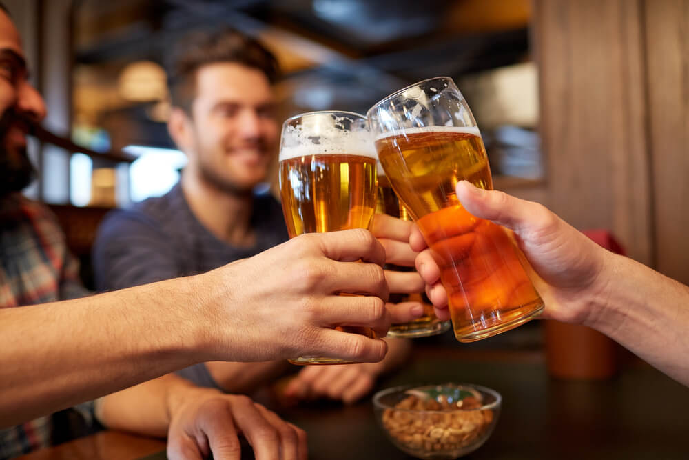 A group with beers at one of the local Ocean Shores bars.
