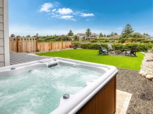 The hot tub in the backyard of an Ocean Shores rental close to the best places to eat.