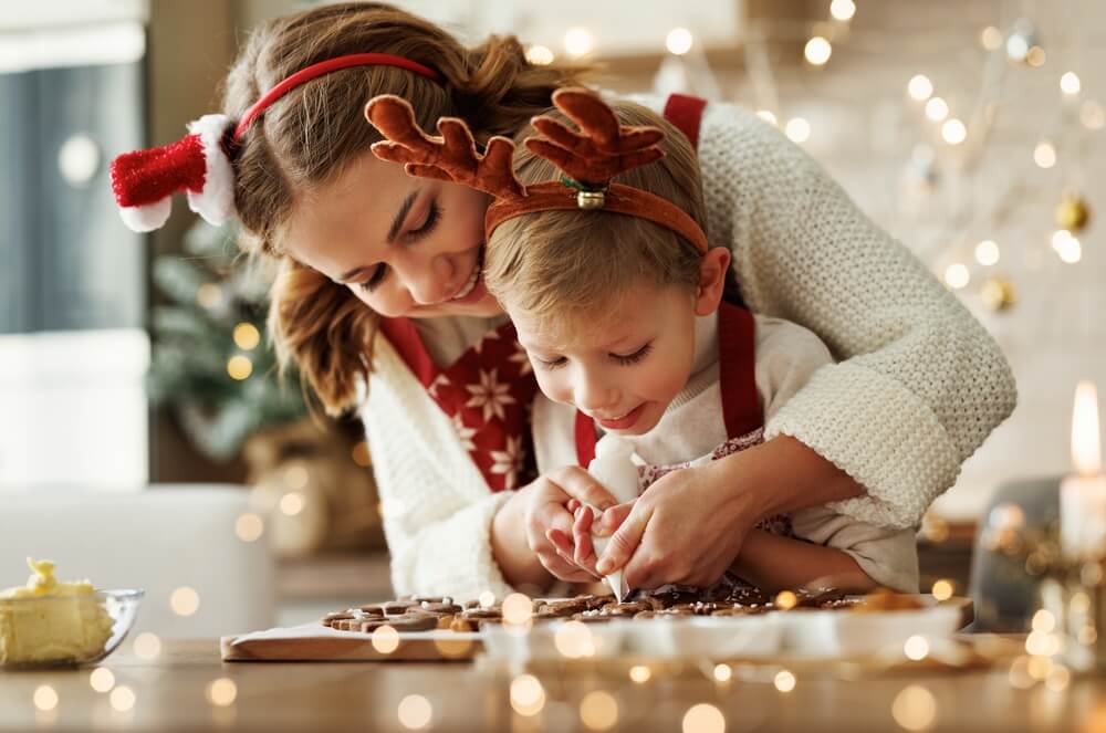 A mom and her child making holiday cookies at one of the vacation cottages in Ocean Shores.