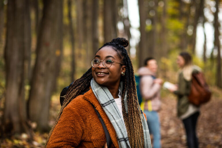 A woman and friends hiking in Ocean Shores on a winter vacation in Washington State.